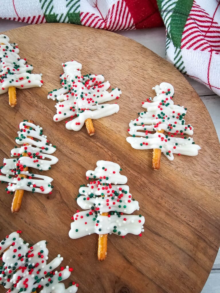 Pretzel Christmas Trees 9 Six Pretzel Christmas Trees on a round wooden board.