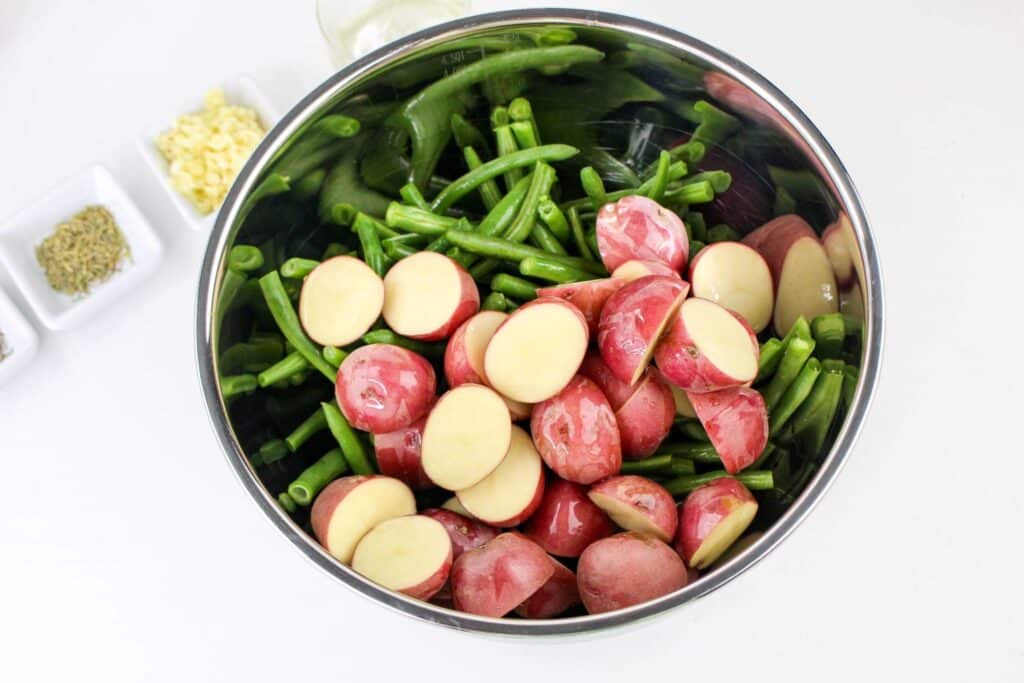 Leftover Roasted Potatoes and Green Beans 5 Overhead shot of a stainless steel bowl with potatoes and green beans in it.