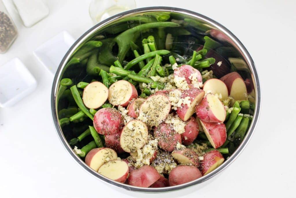 Leftover Roasted Potatoes and Green Beans 6 Overhead shot of a stainless steel bowl with potatoes and green beans in it.