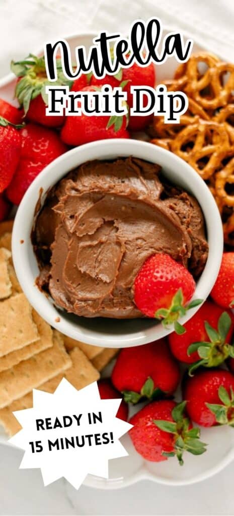 A long Pin for the Fruit Nutella Dip featuring the dip on a white bowl on a platter surrounded with dippables.