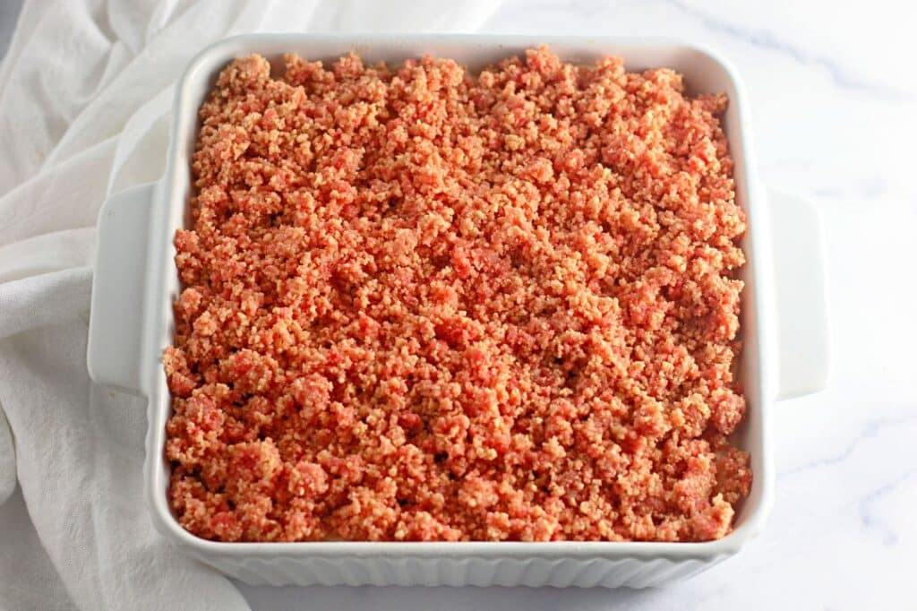 Strawberry Shortcake Crunch Bars with Box Cake Mix 14 High angle shot of a white baking tray with the finished Easy Strawberry Crunch Cake Bars.