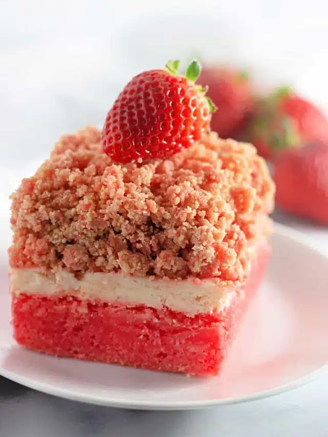 A slice of the Easy Strawberry Crunch Cake Bar on a white dessert plate.