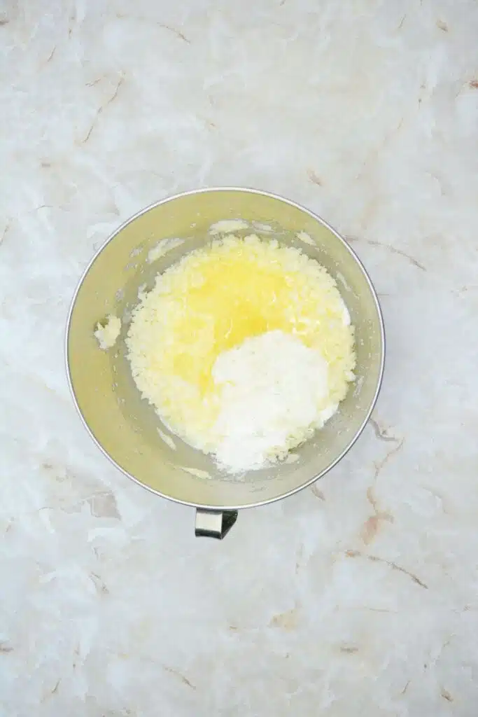 Easy From Scratch Confetti Birthday Cake Roll Recipe with Cream Cheese Frosting 14 Flat lay shot of a mixing bowl with whipped sugar, butter, eggs and a bit of flour.
