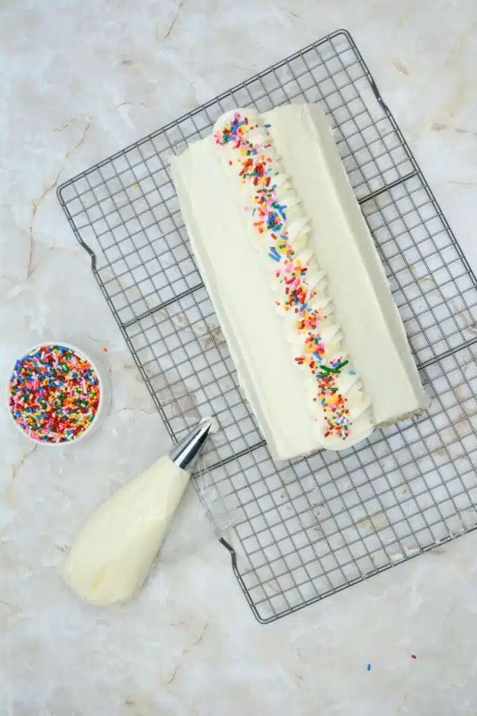Easy From Scratch Confetti Birthday Cake Roll Recipe with Cream Cheese Frosting 31 The finished Delightful Funfetti Birthday Cake Roll on a wire rack.