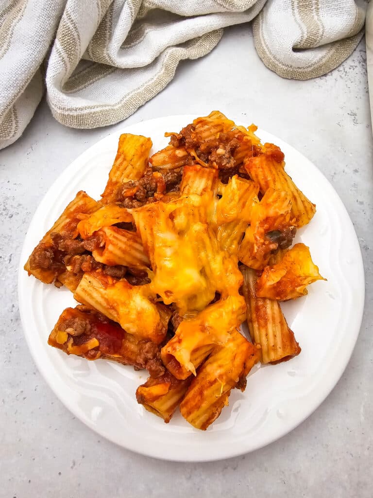 Venison Sloppy Joe Casserole Recipe 17 A plate of Comforting and Family-Friendly Venison Sloppy Joe Casserole on a marble surface.