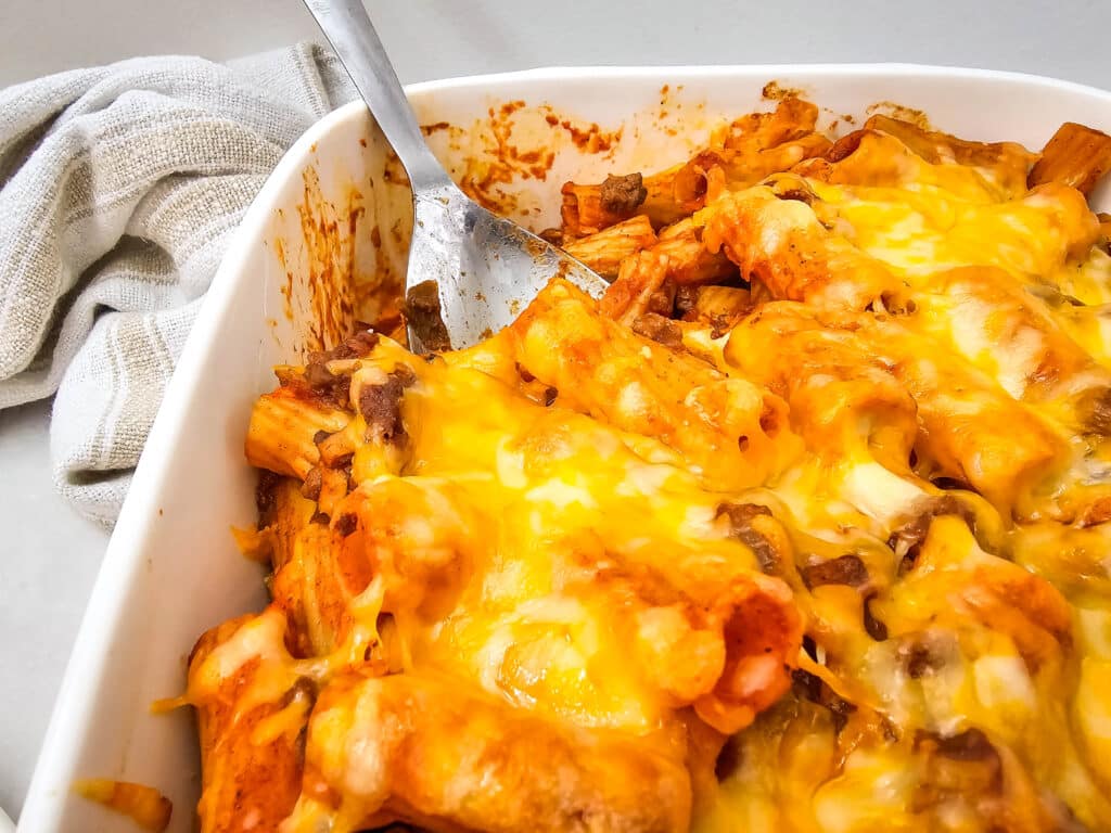 Venison Sloppy Joe Casserole Recipe 18 Closeup shot of the Venison Sloppy Joe Casserole on a white baking dish.