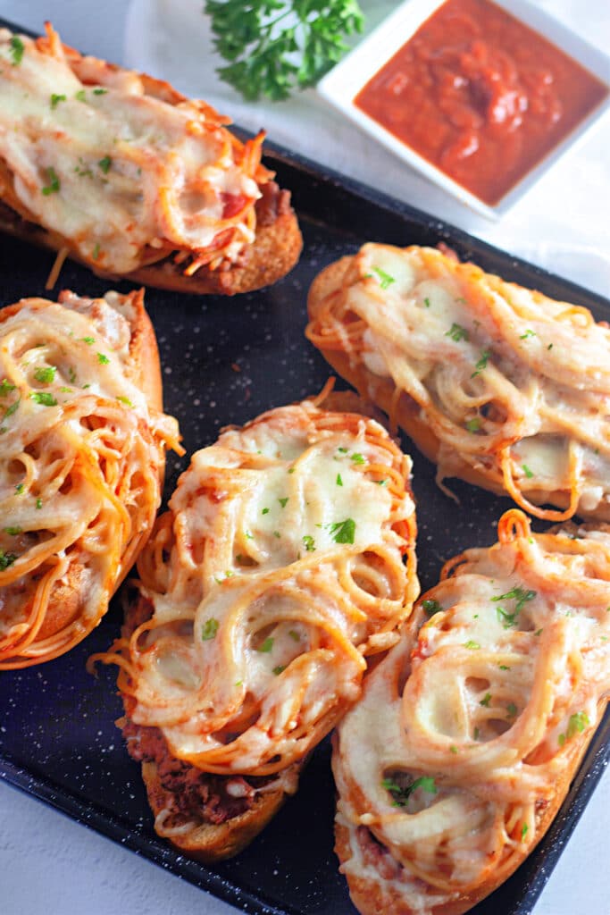 Venison Spaghetti Bread (A Family Favorite!) 25 Flat lay shot of a sheet tray with a batch of Venison Spaghetti Bread.