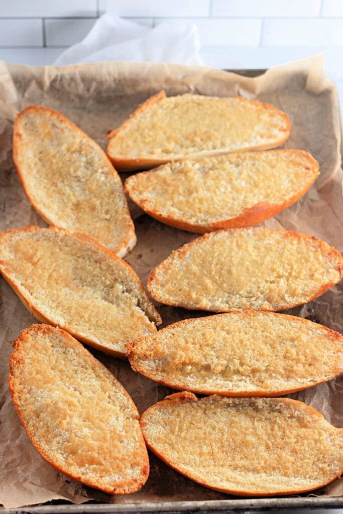 Venison Spaghetti Bread (A Family Favorite!) 12 A sheet tray with toasted buttered Hoagie rolls.