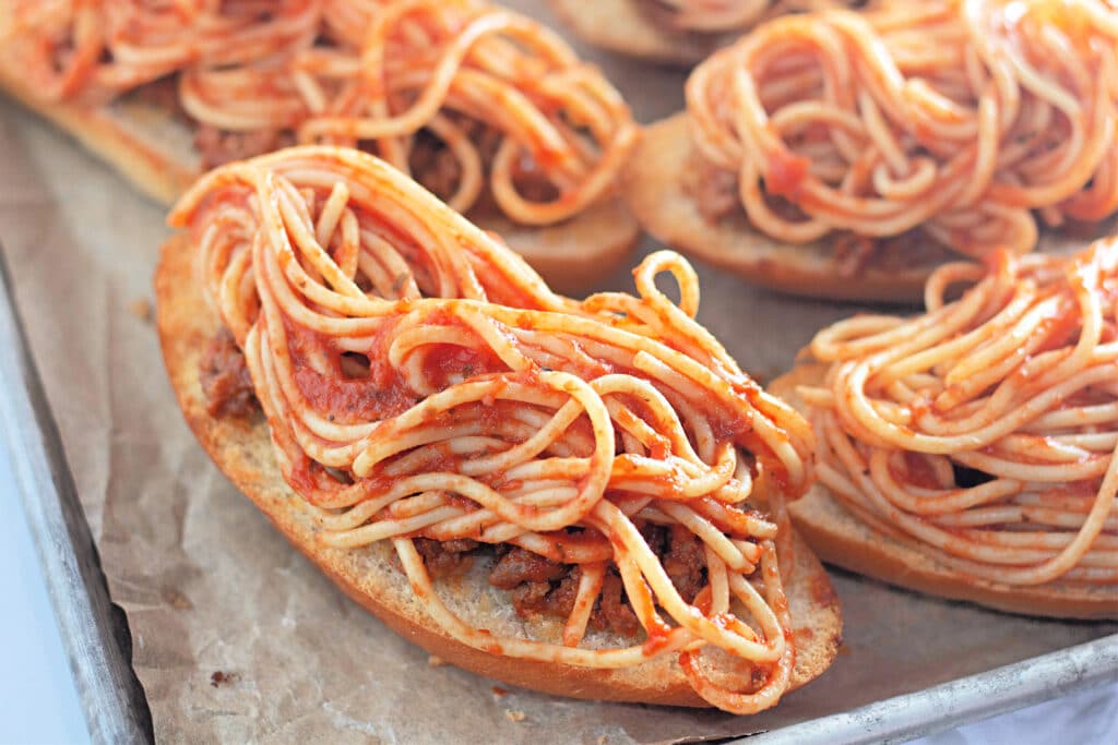 Venison Spaghetti Bread (A Family Favorite!) 22 Hoagie halves topped with spaghetti.