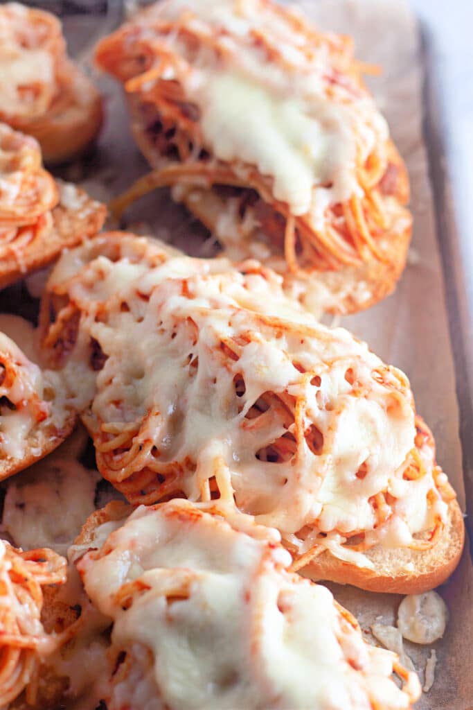 Venison Spaghetti Bread (A Family Favorite!) 18 Close-up shot of the Venison Spaghetti Bread in a sheet tray.